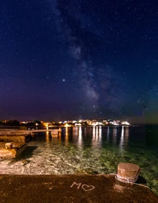 Milky Way over coastal landscape