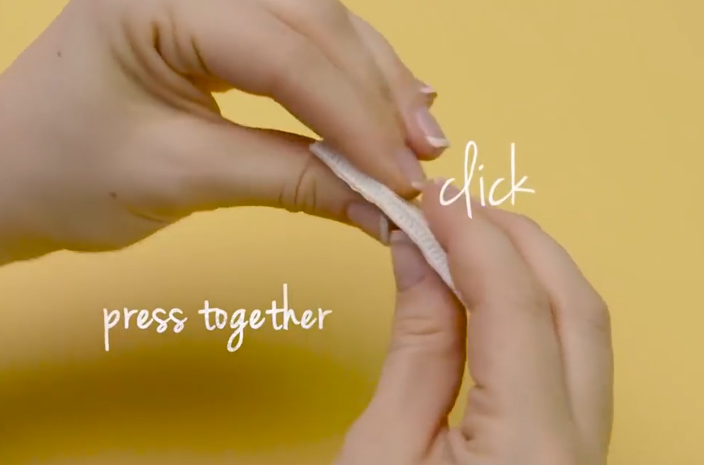 Adhesive strips pairs being clicked together.